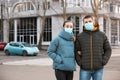 Couple wearing disposable masks. Dangerous virus