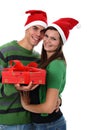 Couple wearing Santa hats isolated on white