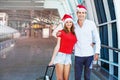 A couple wearing santa's hats