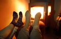 Couple wearing woollen socks near fireplace Royalty Free Stock Photo