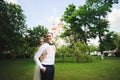 Couple in wedding attire is in the hands against the backdrop of the field at sunset, the bride and groom Royalty Free Stock Photo