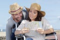 couple in wheelchair looking at map Royalty Free Stock Photo