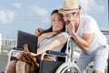 couple in wheelchair taking wacky selfie tongue out Royalty Free Stock Photo