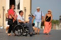 Couple with wheelchair and walking couple