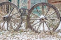 Chained wheels of old wooden field carts Royalty Free Stock Photo