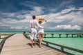 Couple in white on a beach jetty at Maldives Royalty Free Stock Photo