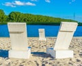 Couple of white beach seats at the beach lake Royalty Free Stock Photo