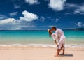 Couple in white having fun on a beach