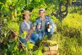 Couple of winegrowers tasting white wine in vineyard Royalty Free Stock Photo