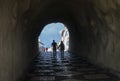 A couple wlking through a pedestrian tunnel Royalty Free Stock Photo