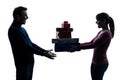 Couple woman man offering christmas gifts silhouette