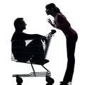 Couple woman with man sitting in shopping cart silhouette Royalty Free Stock Photo