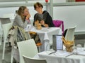 Couple of women chooses from the menu seating in the restaurant Royalty Free Stock Photo