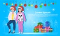 Couple women wearing red hat happy new year merry christmas concept flat gift box decoration blue background full length