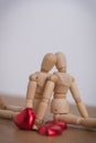 A couple of wooden doll man on valentine days showing love to each other Royalty Free Stock Photo