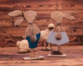 Couple of wooden easter bunnies near toy sheep Royalty Free Stock Photo