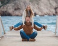 Couple on wooden pier near the sea in autumn Royalty Free Stock Photo