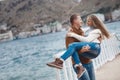 Couple on wooden pier near the sea in autumn Royalty Free Stock Photo