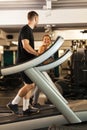 Couple working out on a treadmill in a fitness club Royalty Free Stock Photo