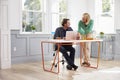 Couple Working Together At Desk In Home Office Royalty Free Stock Photo