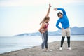 Couple worming up for a training on the beach Royalty Free Stock Photo