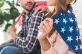 couple wrapped in American flag Royalty Free Stock Photo