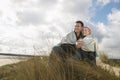 Couple Wrapped In Blanket On Beach Royalty Free Stock Photo