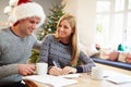 Couple Writing Christmas Cards Together Royalty Free Stock Photo