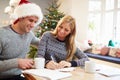 Couple Writing Christmas Cards Together Royalty Free Stock Photo