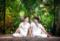 Couple yoga matsyendrasana pose Royalty Free Stock Photo