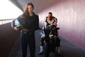 Couple of young bikers is relaxing in quiet tunnel with their motobike Royalty Free Stock Photo