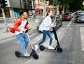 couple young electric scooter city transport riding technology lifestylestreet friend driving modern