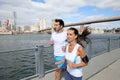 Couple of young joggers running on brooklyn promenade