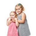 Couple of young little girls standing over isolated white background Royalty Free Stock Photo