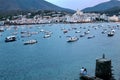 A couple of young lovers enjoying a summer sunset in Punta de Sa Costa viewpoint with Cadaques bay