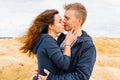 A couple of young lovers a man and a woman in the desert with sand dunes of bizarre shape Royalty Free Stock Photo