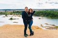 A couple of young lovers a man and a woman in the desert with sand dunes of bizarre shape Royalty Free Stock Photo