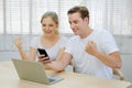 Couple of young man and woman lovers use mobile phone to scan screen for online shopping and action of happy Royalty Free Stock Photo