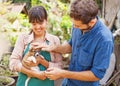 Couple of young people caring about the dog Royalty Free Stock Photo