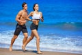 Couple young running in the beach in summer