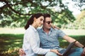 Couple young teen lover sitting and using laptop computer together at park,Romantic and enjoying in moment of happiness time,Happy Royalty Free Stock Photo