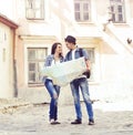 Couple of young travelers with a map