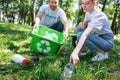 couple of young volunteers with recycling box cleaning Royalty Free Stock Photo