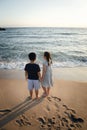 Couples of asian children standing at seaside Royalty Free Stock Photo