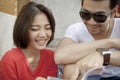 couples of asian younger man and woman laughing happiness emotion ,traveling destination