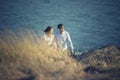 Couples of asian younger man and woman relaxing at sea beach