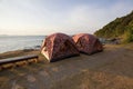 Couples of camping tent in font of sea beach with morning light