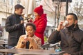 Mixed-races young couple sitting and drinking coffee Royalty Free Stock Photo