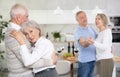 Couple of elderly man and woman dancing in kitchen Royalty Free Stock Photo