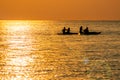 Couples Enjoy Golder Sunset while Kayaking out on the Sea Royalty Free Stock Photo